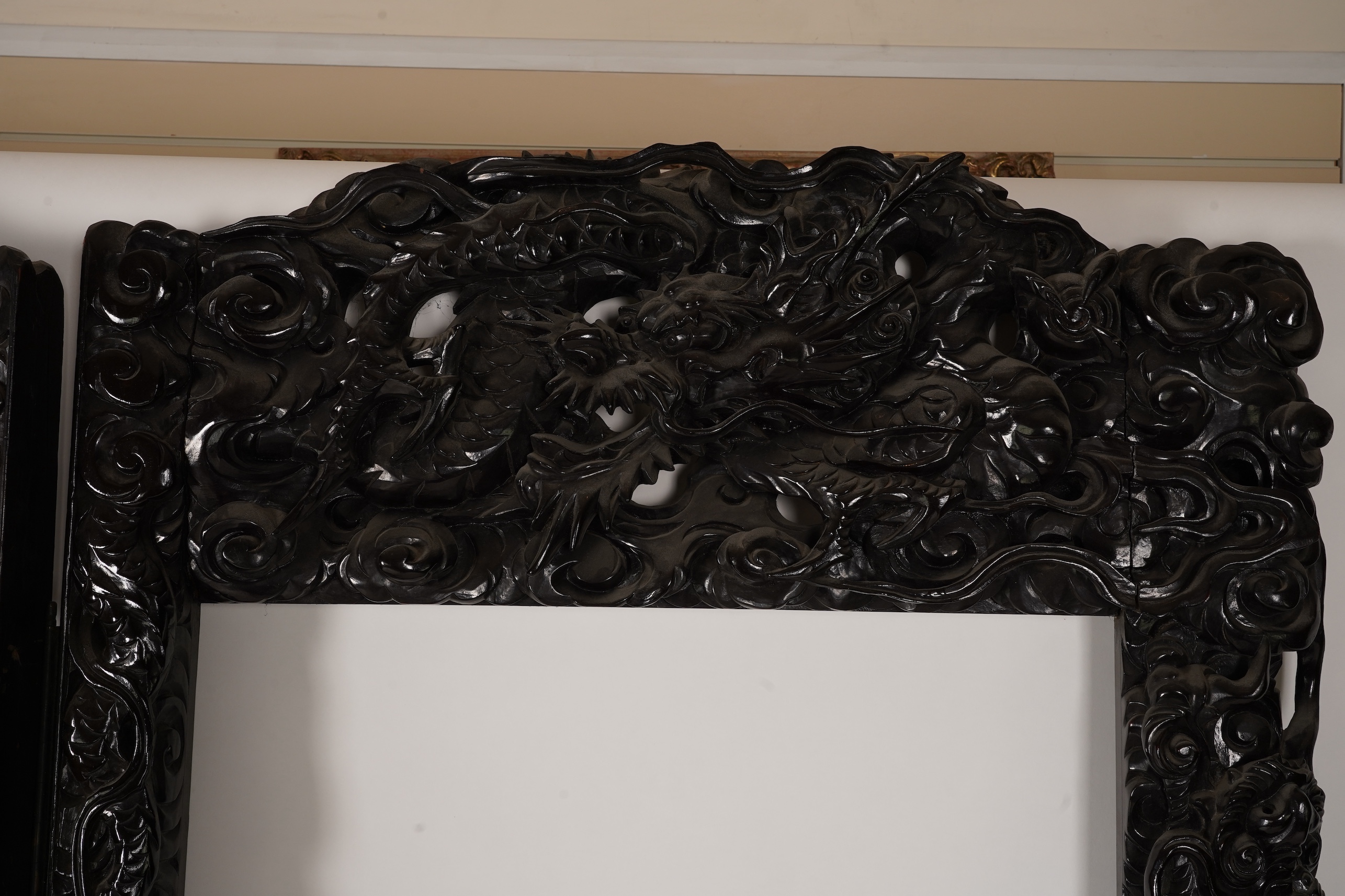A pair of large Japanese carved hardwood ’dragon’ screen frames, Meiji period